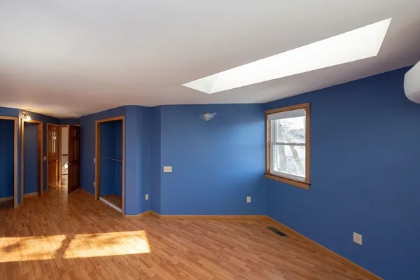 a bedroom with a bed and painted walls