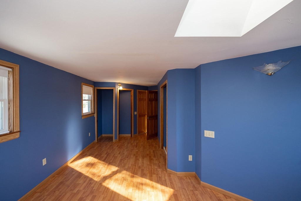 2 Teconnett Path Worcester, MA 01605 - Photo 14 of 36 a bedroom with a bed and painted walls