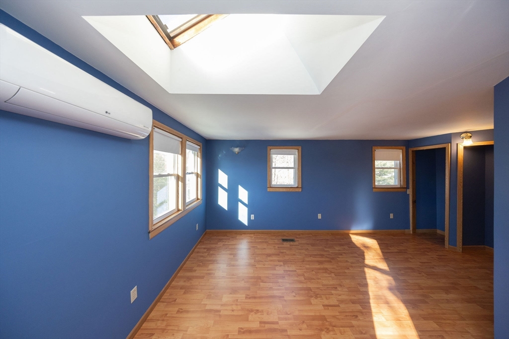 2 Teconnett Path Worcester, MA 01605 - Photo 16 of 36 a view of an empty room with wooden floor and windows