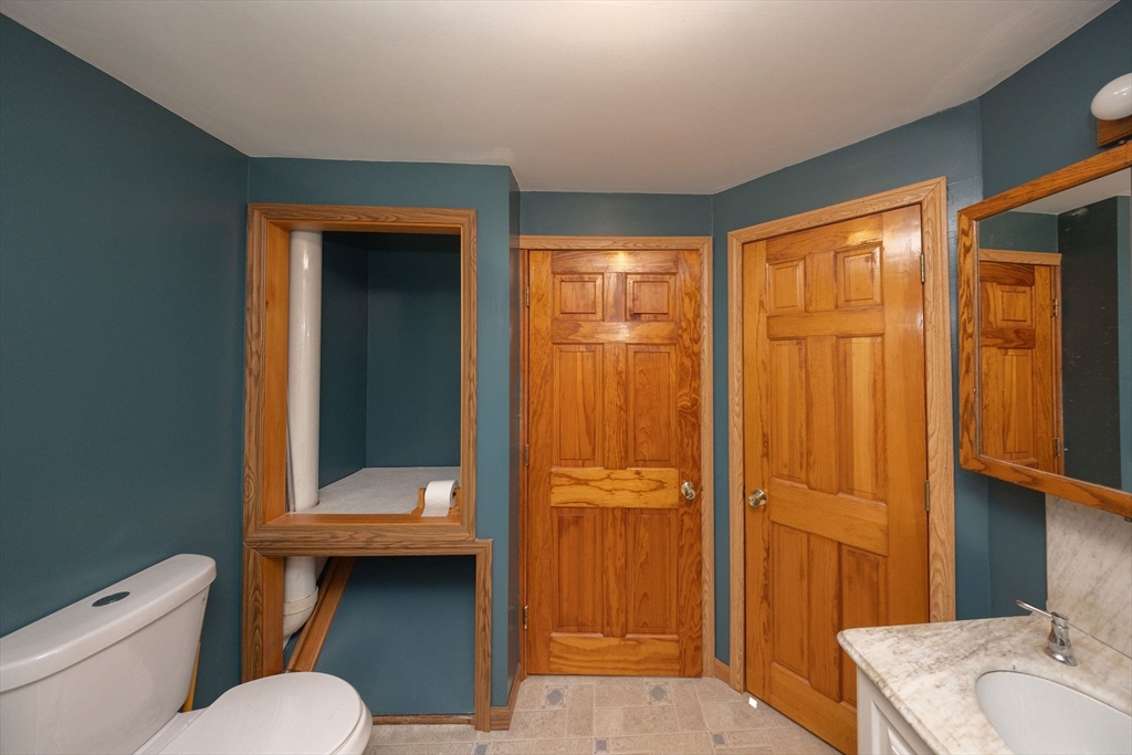 2 Teconnett Path Worcester, MA 01605 - Photo 19 of 36 a bathroom with a sink a toilet and shower