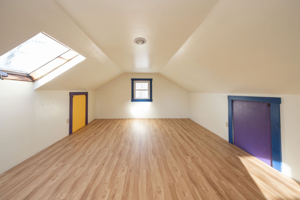 2 Teconnett Path Worcester, MA 01605 - Photo 21 of 36 a view of empty room with wooden floor and fan