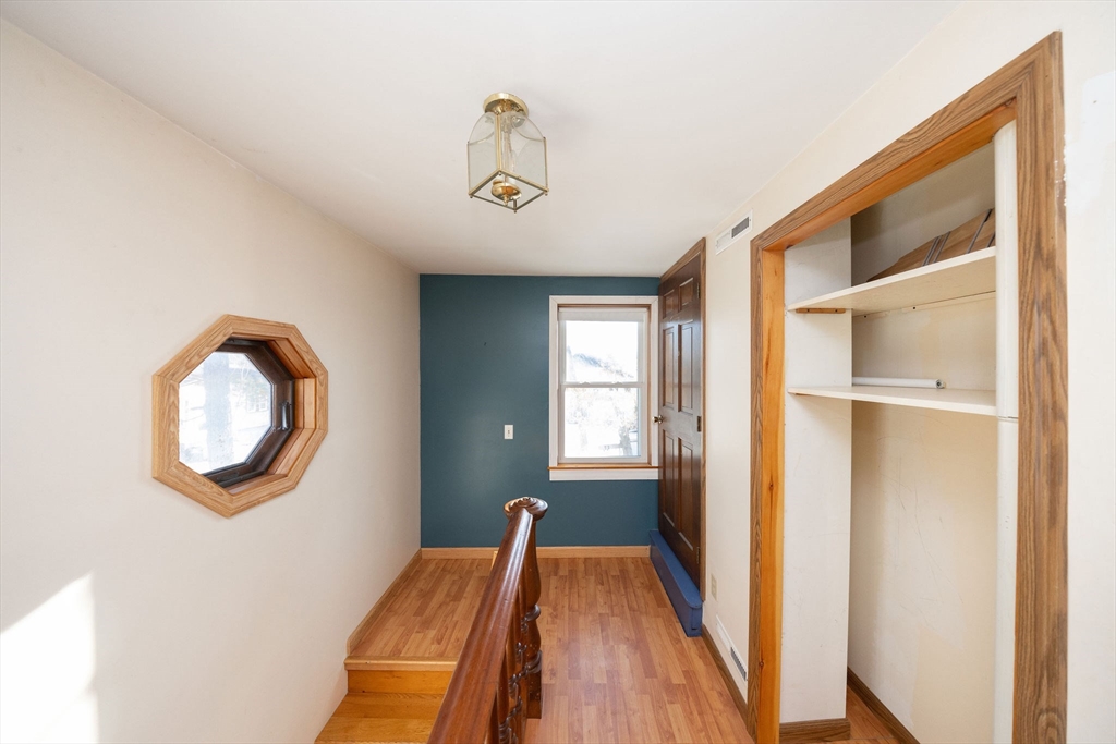 2 Teconnett Path Worcester, MA 01605 - Photo 23 of 36 a view of a bedroom with wooden floor and windows