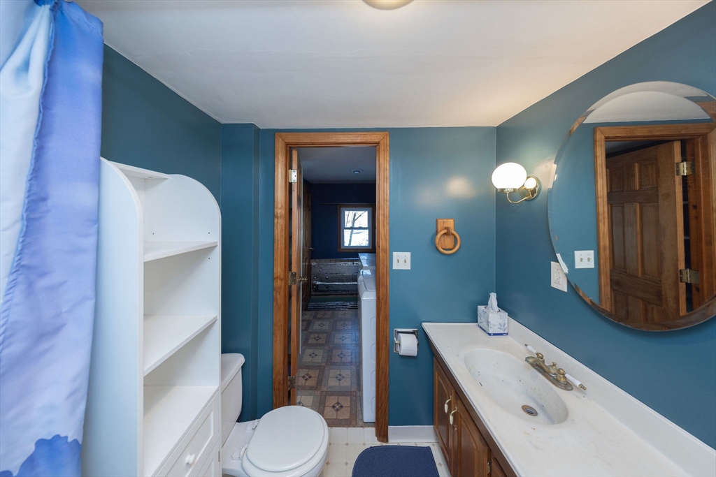 2 Teconnett Path Worcester, MA 01605 - Photo 28 of 36 a bathroom with a sink a toilet and mirror