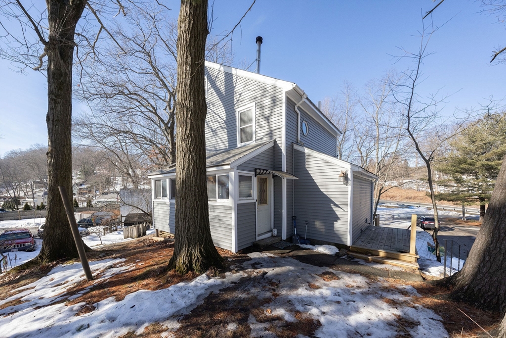 2 Teconnett Path Worcester, MA 01605 - Photo 33 of 36 a view of a building with a bench next to a road