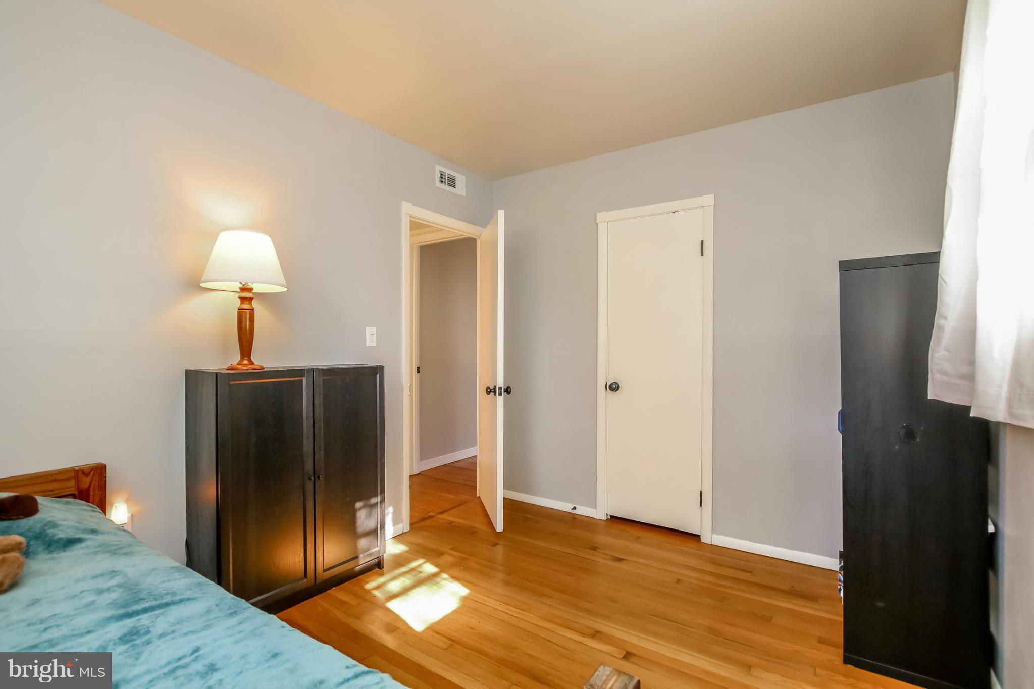832 Templecliff Road Pikesville, MD 21208 - Photo 19 of 30 a view of empty room with wooden floor