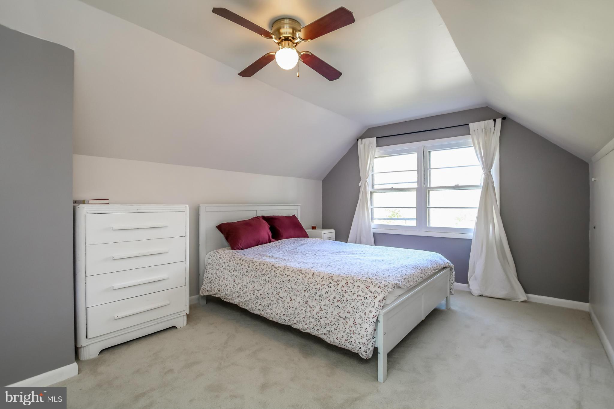 832 Templecliff Road Pikesville, MD 21208 - Photo 21 of 30 a bedroom with a bed and a ceiling fan
