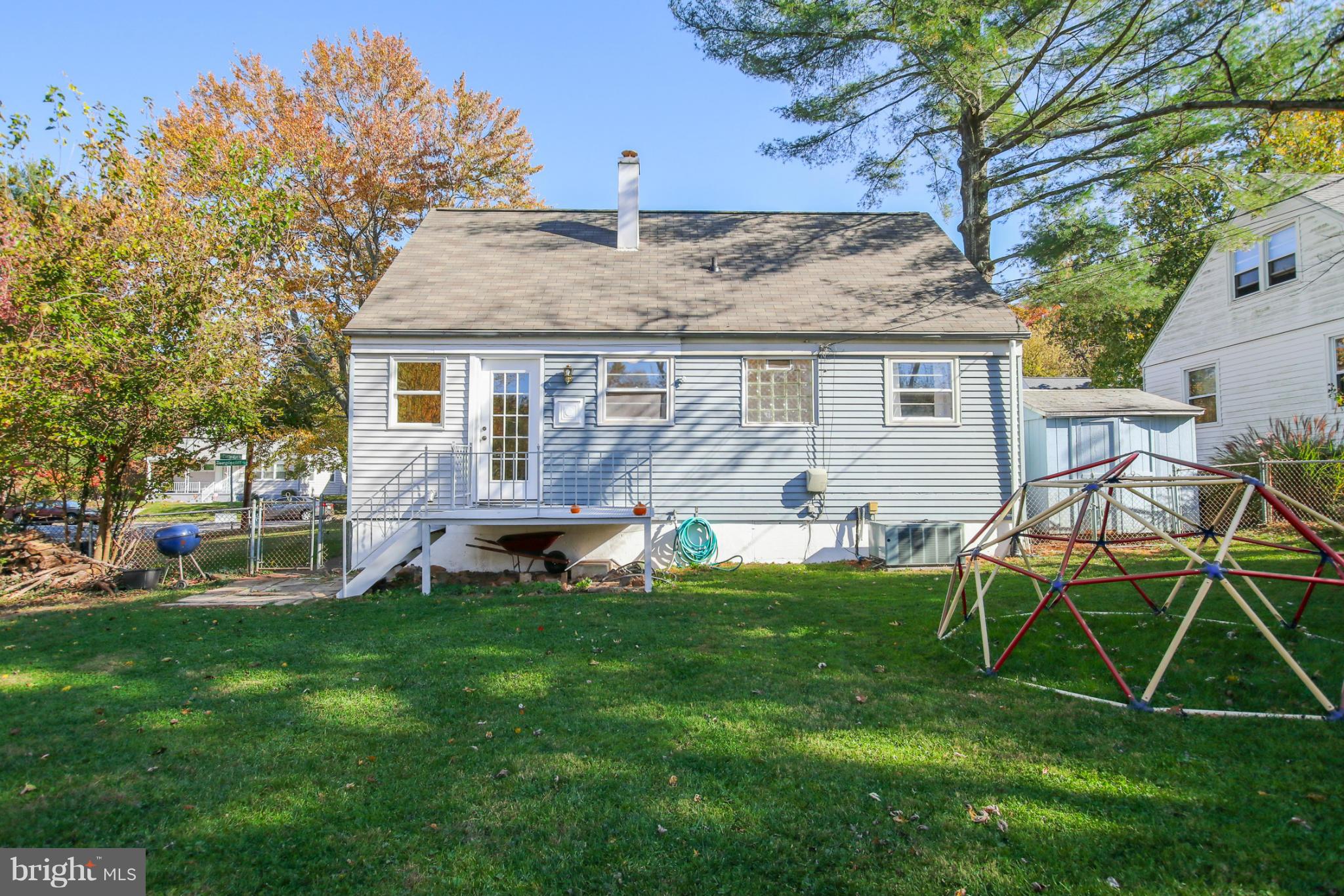 832 Templecliff Road Pikesville, MD 21208 - Photo 29 of 30 a view of a house with a yard and sitting area