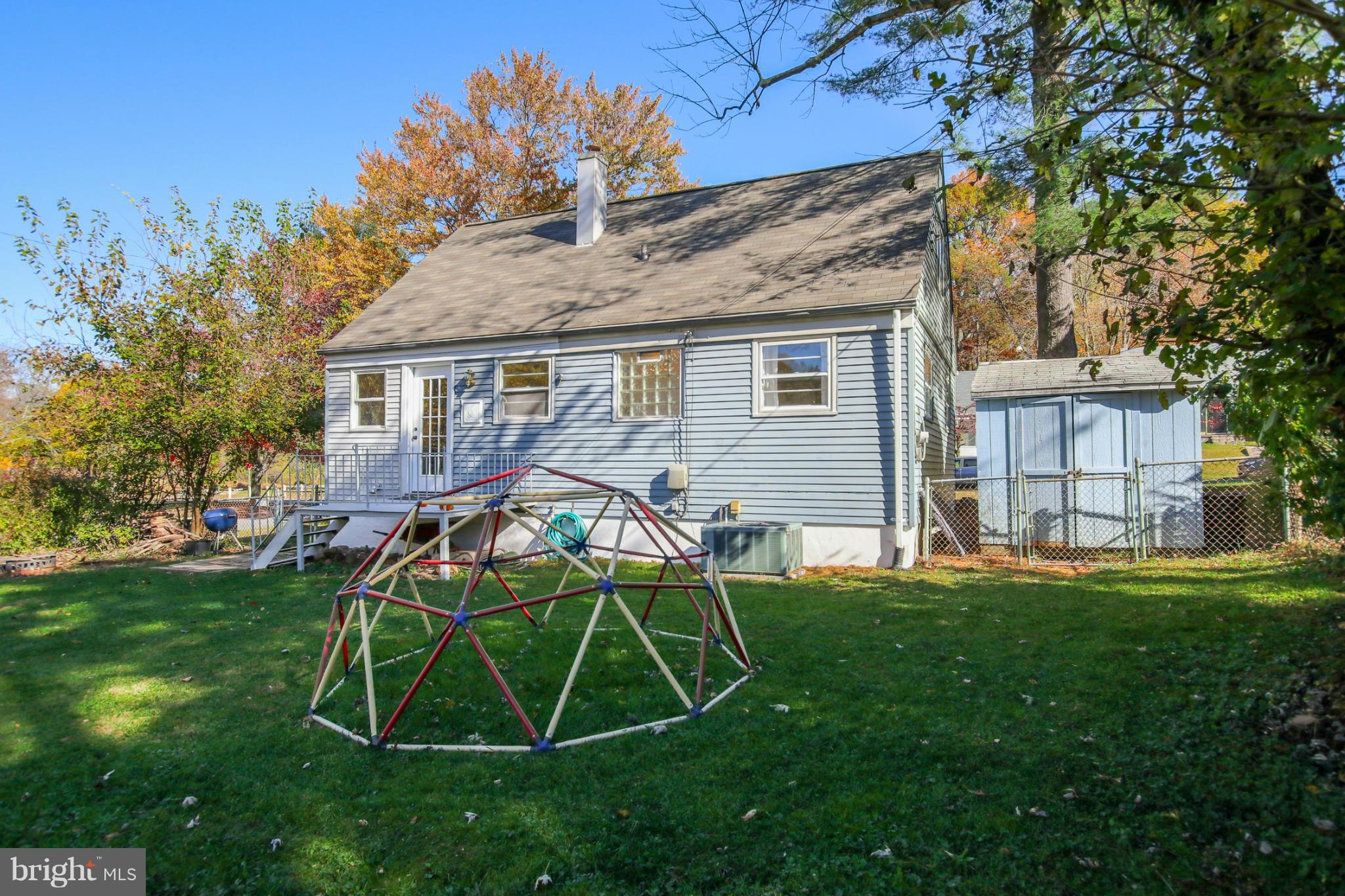 832 Templecliff Road Pikesville, MD 21208 - Photo 30 of 30 a view of a backyard with table and chairs and a barbeque