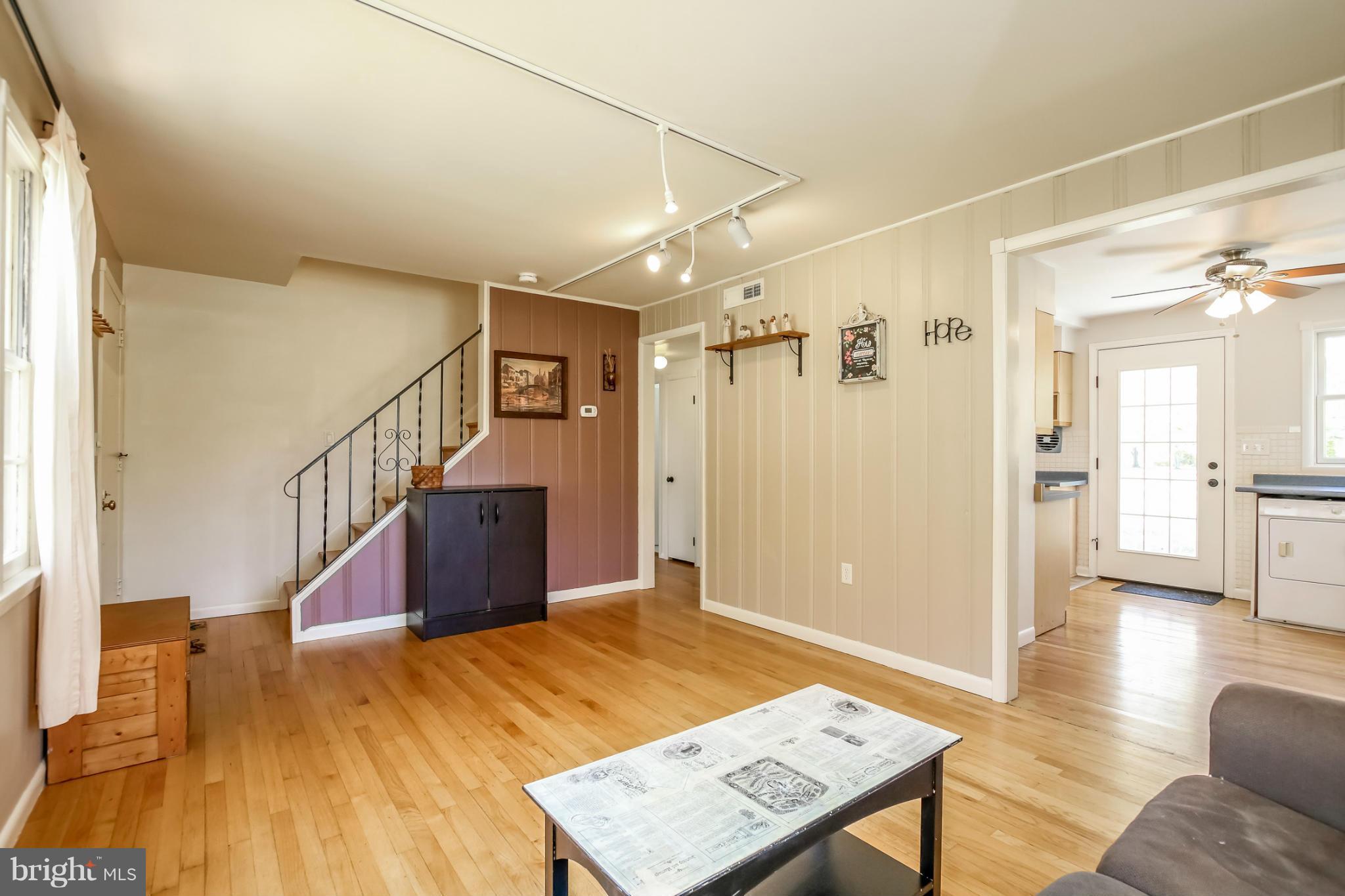 832 Templecliff Road Pikesville, MD 21208 - Photo 7 of 30 a view of a hallway view with wooden floor and staircase