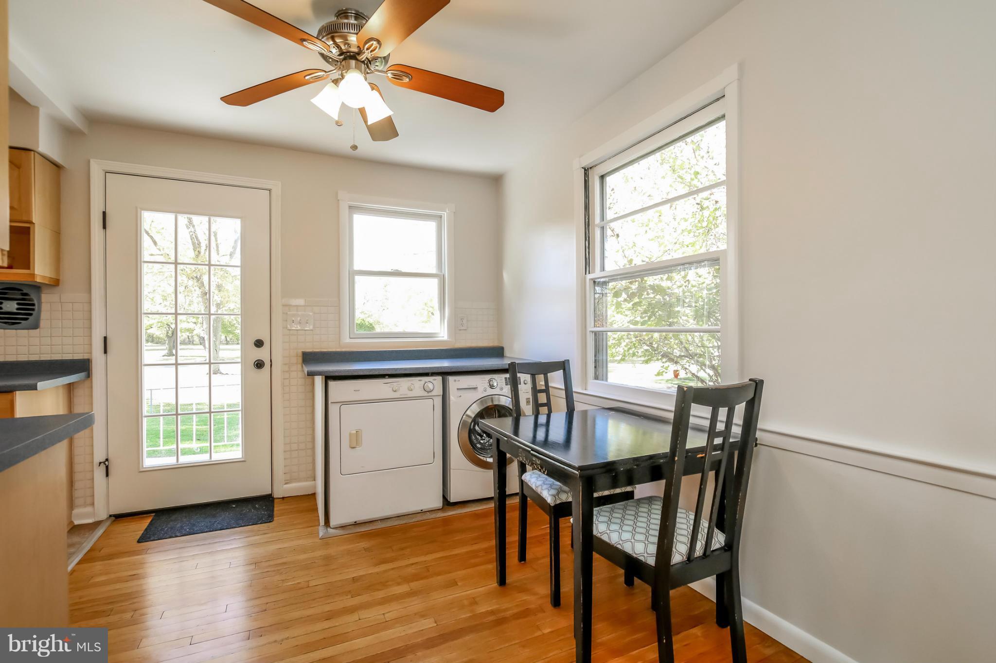 832 Templecliff Road Pikesville, MD 21208 - Photo 8 of 30 a view of a dining room with furniture window and wooden floor
