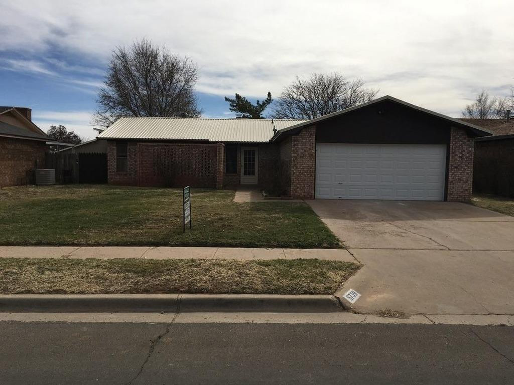 5739 Emory Street Lubbock, TX 79416 - Photo 1 of 14 a front view of a house with garage