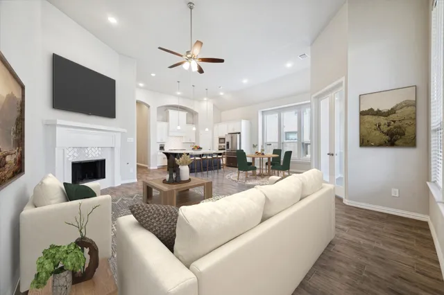 a living room with fireplace furniture and a flat screen tv