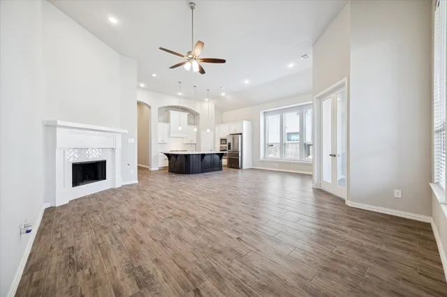 a view of livingroom with kitchen and hardwood