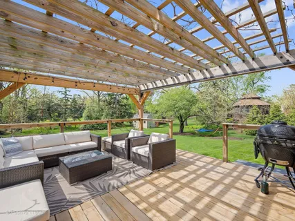 a view of a patio with couches and chairs