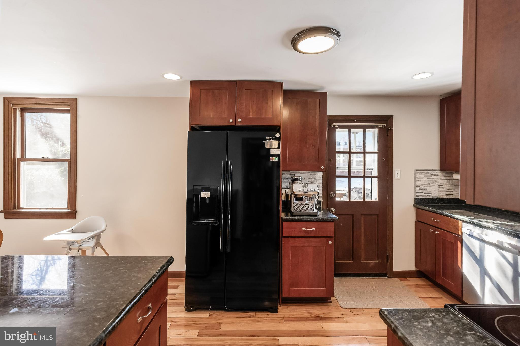 531 Gilbert Street Media, PA 19063 - Photo 17 of 45 a kitchen with granite countertop a refrigerator and a stove top oven