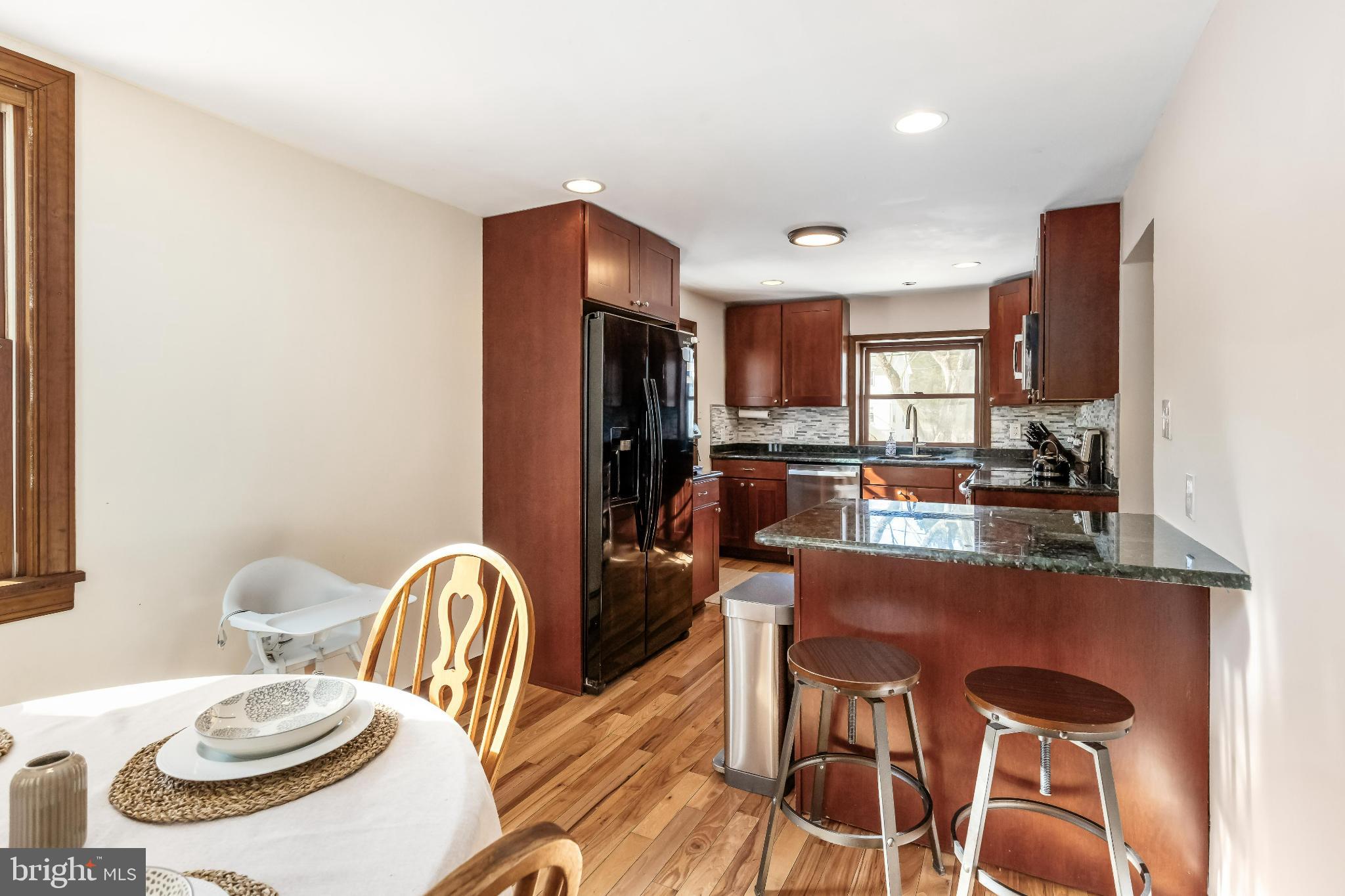 531 Gilbert Street Media, PA 19063 - Photo 19 of 45 a kitchen with stainless steel appliances a dining table and chairs