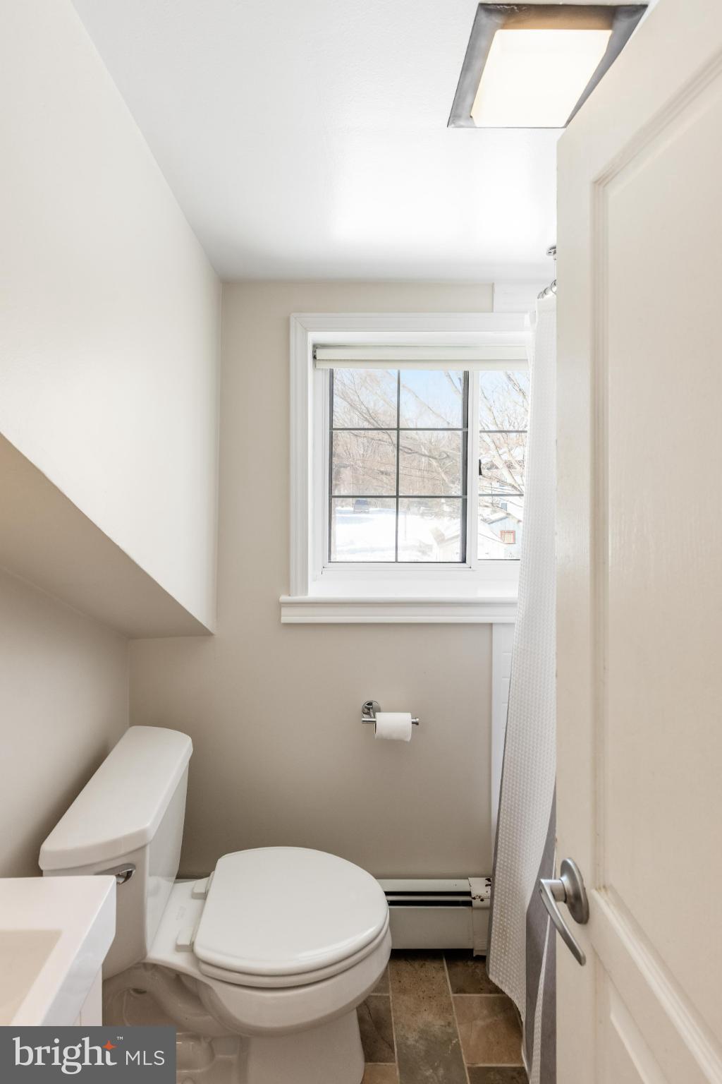 531 Gilbert Street Media, PA 19063 - Photo 36 of 45 a white toilet sitting next to a bathroom sink