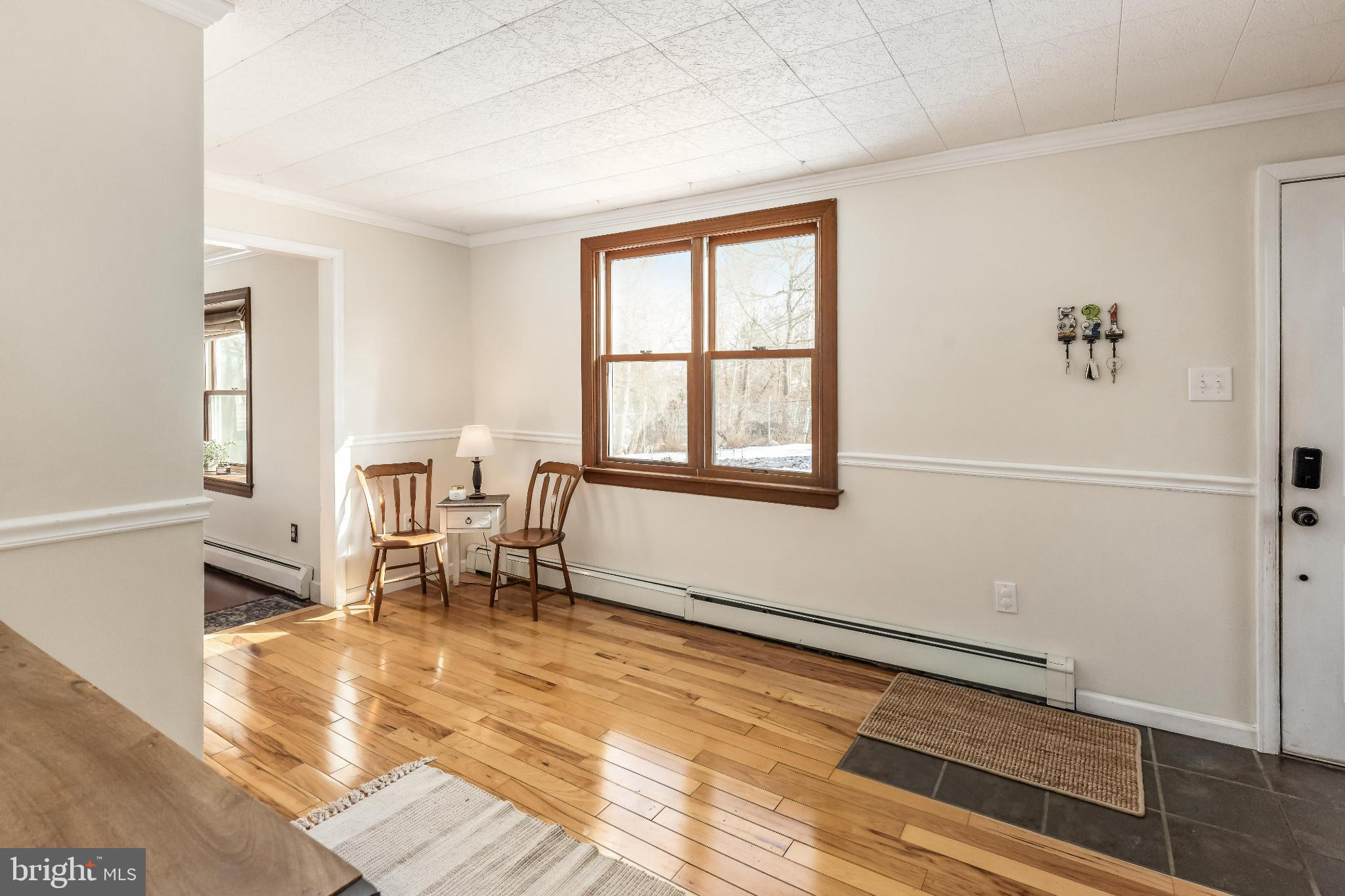 531 Gilbert Street Media, PA 19063 - Photo 8 of 45 a living room with a table and a window with wooden floor