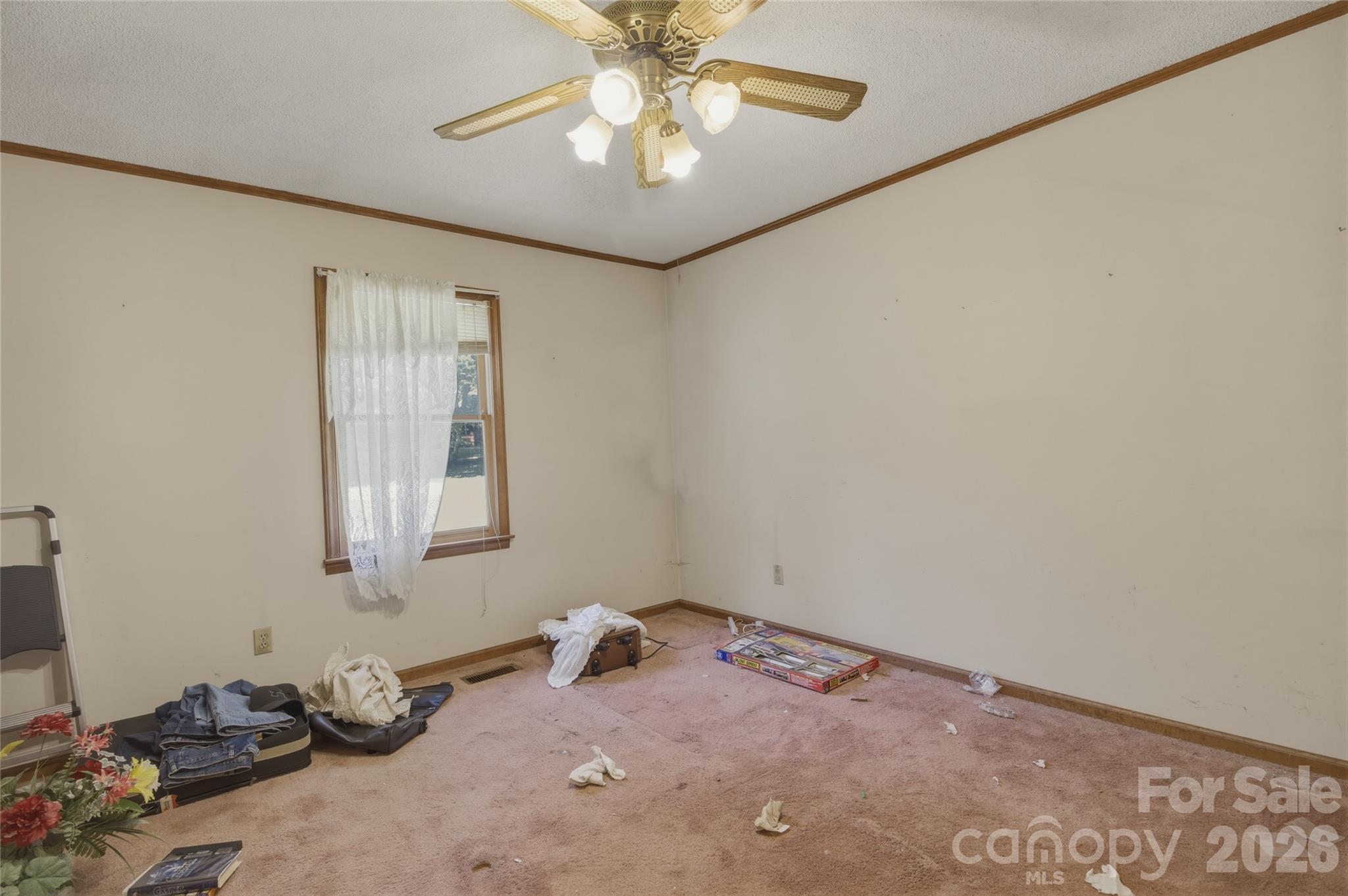 8226 Normandy Road Denver, NC 28037 - Photo 24 of 29 a room with window and a ceiling fan