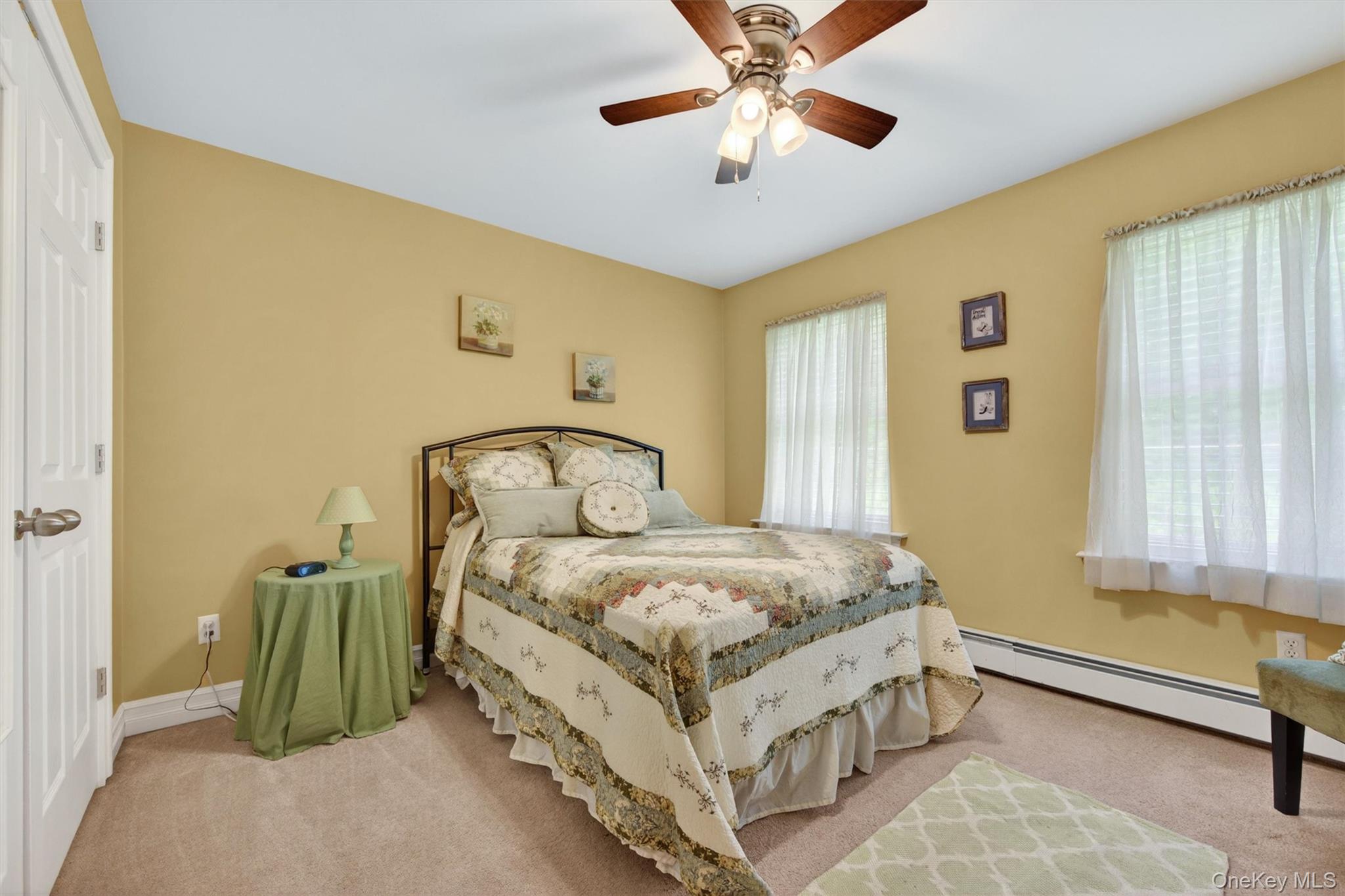 19 Pirog Road Pine Bush, NY 12566 - Photo 27 of 50 a bedroom with a bed and a chandelier
