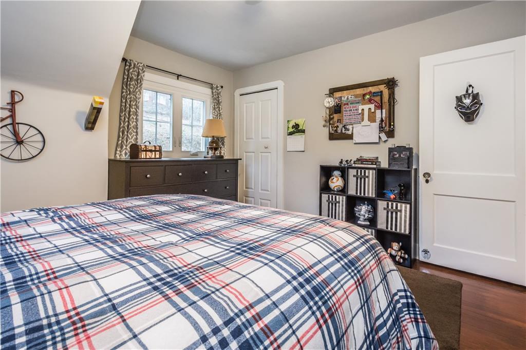 105 Fahnestock Road Pittsburgh, PA 15215 - Photo 15 of 20 a bedroom with a bed and a cabinets