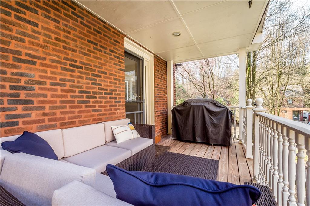 105 Fahnestock Road Pittsburgh, PA 15215 - Photo 4 of 20 a living room with furniture and a floor to ceiling window