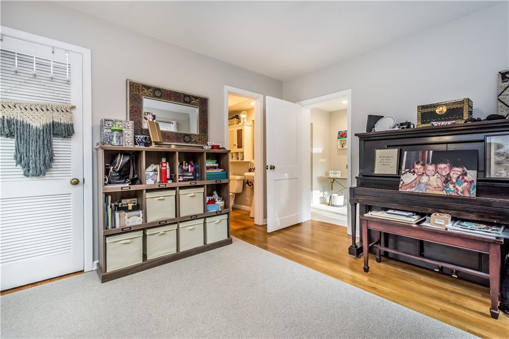 105 Fahnestock Road Pittsburgh, PA 15215 - Photo 10 of 20 a bedroom with furniture and a book shelf