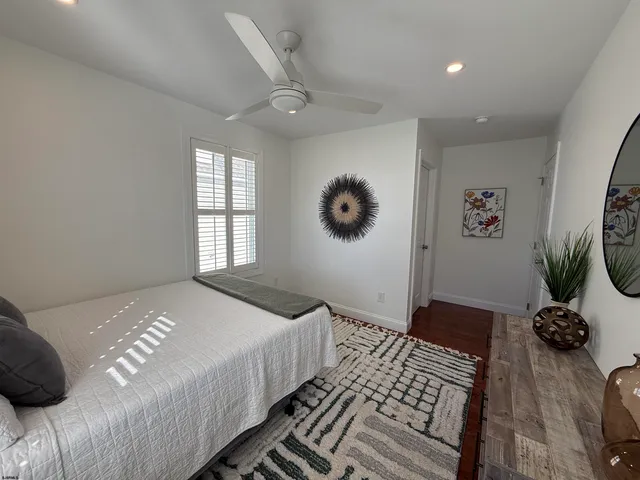 a bathroom with a granite countertop sink mirror and double