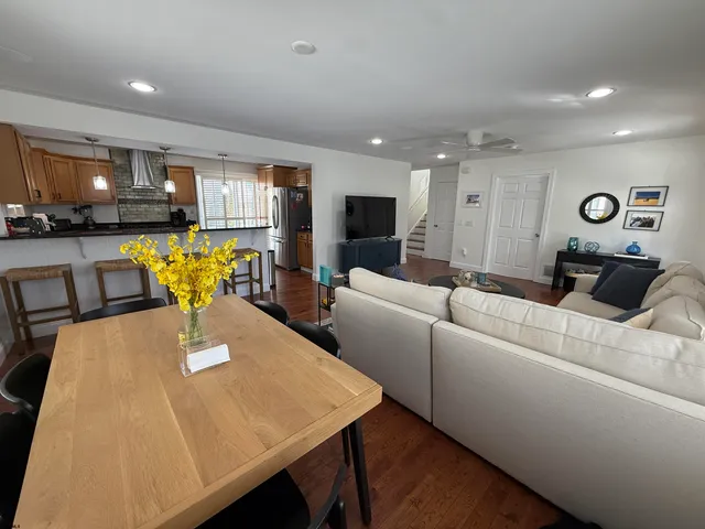 a living room with furniture and a table