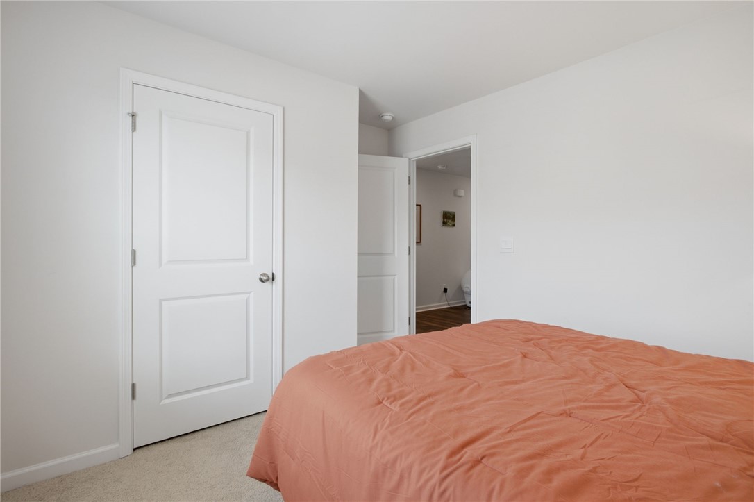 216 Boxbury Way Fountain Inn, SC 29644 - Photo 6 of 28 Plush carpeting and crisp white trim create a cozy, neutral retreat.