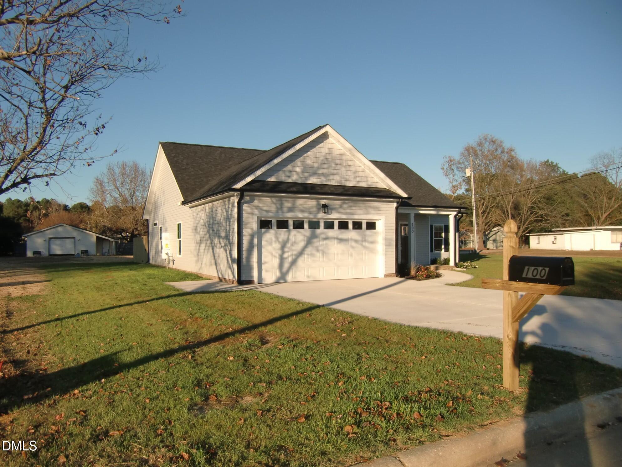 100 Covington Lane Dunn, NC 28334 - Photo 13 of 61 a front view of a house with a yard
