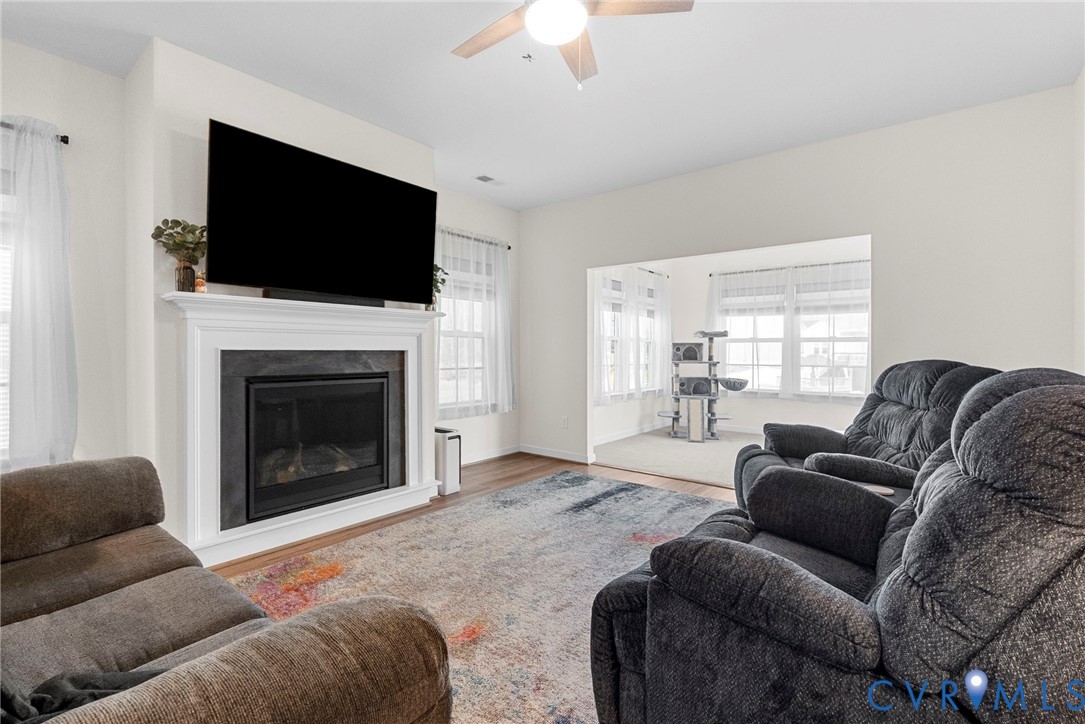 48 James Court Aylett, VA 23009 - Photo 13 of 30 a living room with furniture a fireplace and a flat screen tv