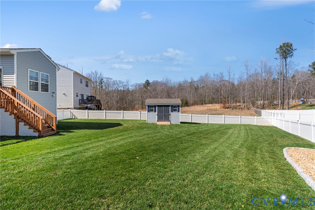 48 James Court Aylett, VA 23009 - Photo 23 of 30 a view of a house with a yard and a garden