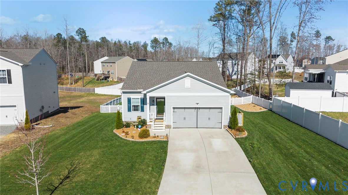 48 James Court Aylett, VA 23009 - Photo 26 of 30 a front view of a house with a yard