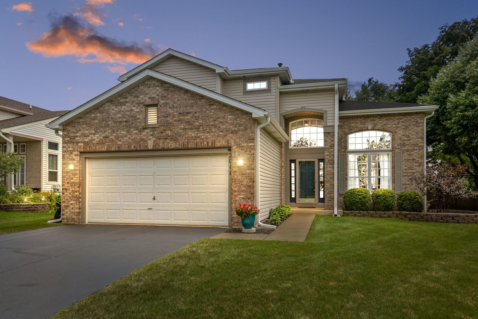2011 Baldwin Way Bolingbrook, IL 60490 - Photo 1 of 21 a front view of a house with a yard