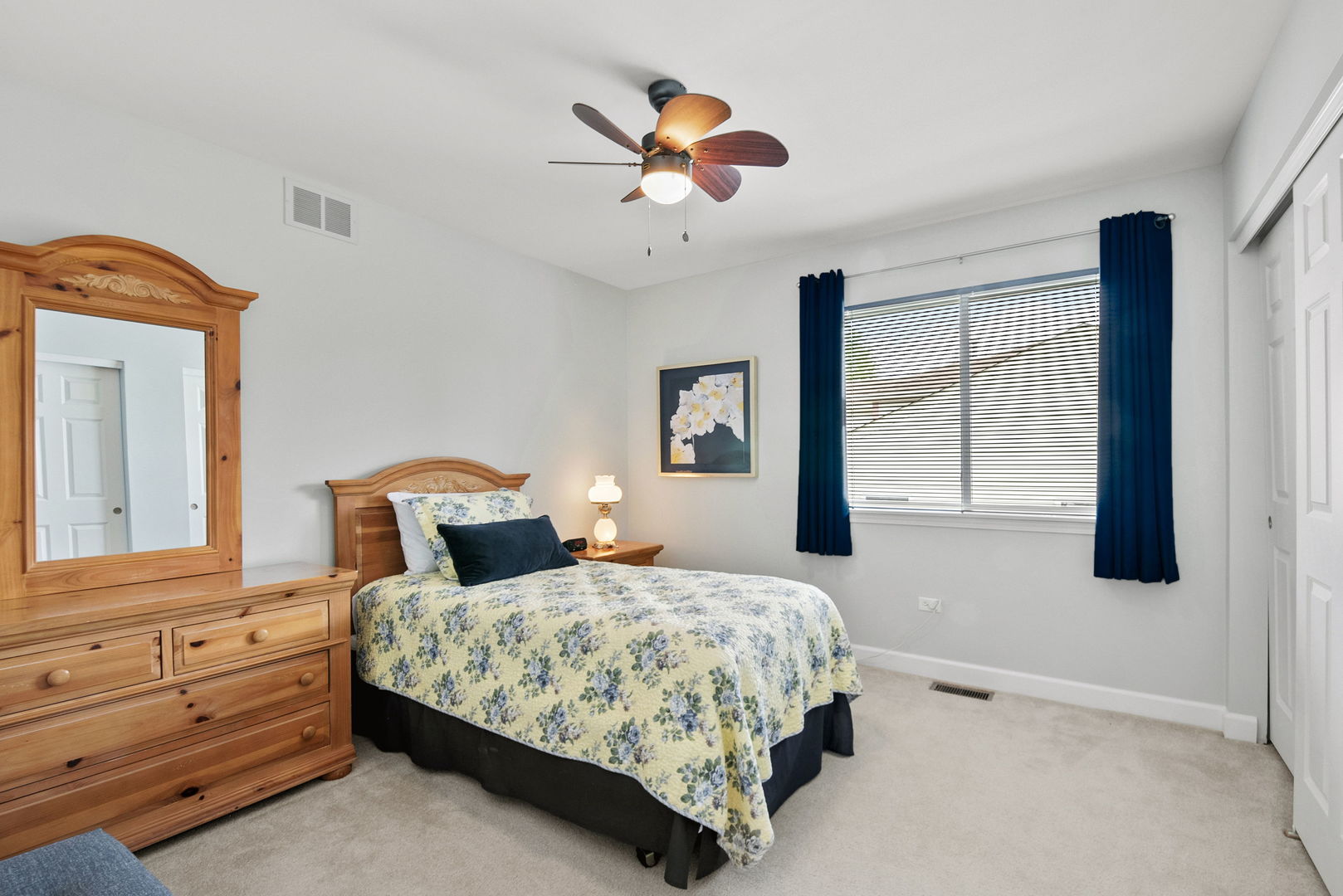 2011 Baldwin Way Bolingbrook, IL 60490 - Photo 17 of 21 a bedroom with a large bed and a chandelier fan