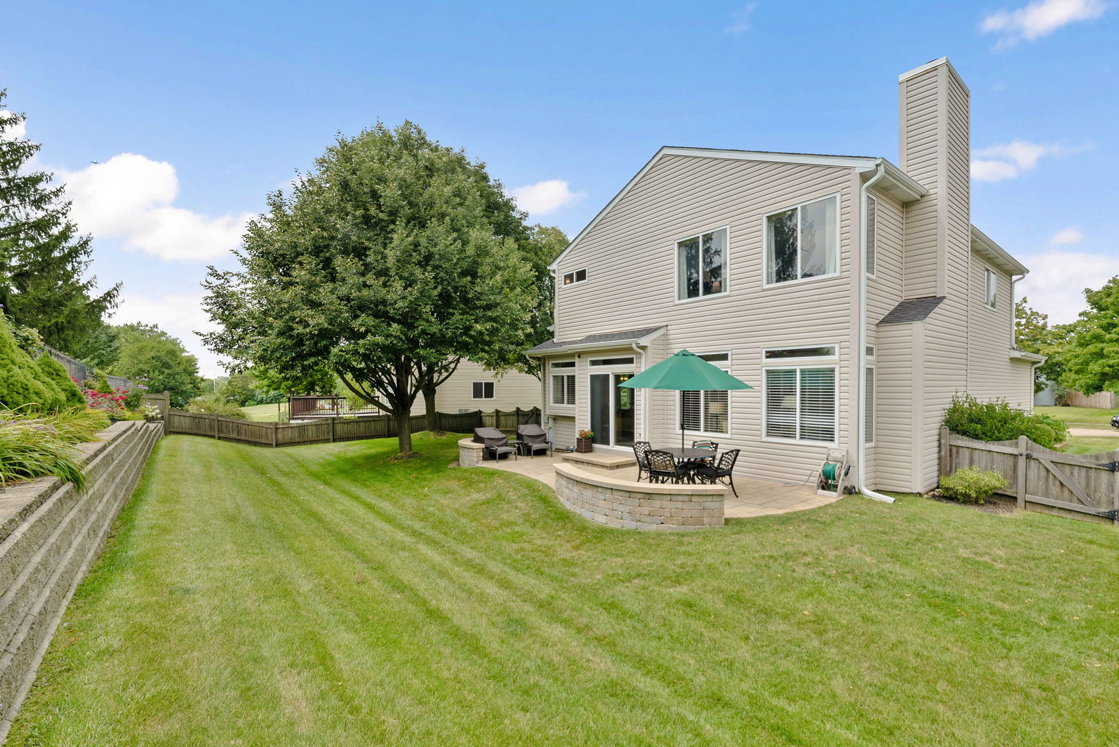 2011 Baldwin Way Bolingbrook, IL 60490 - Photo 19 of 21 a front view of house with patio and garden