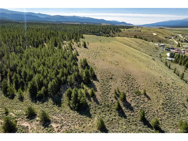 a view of an ocean and a mountain