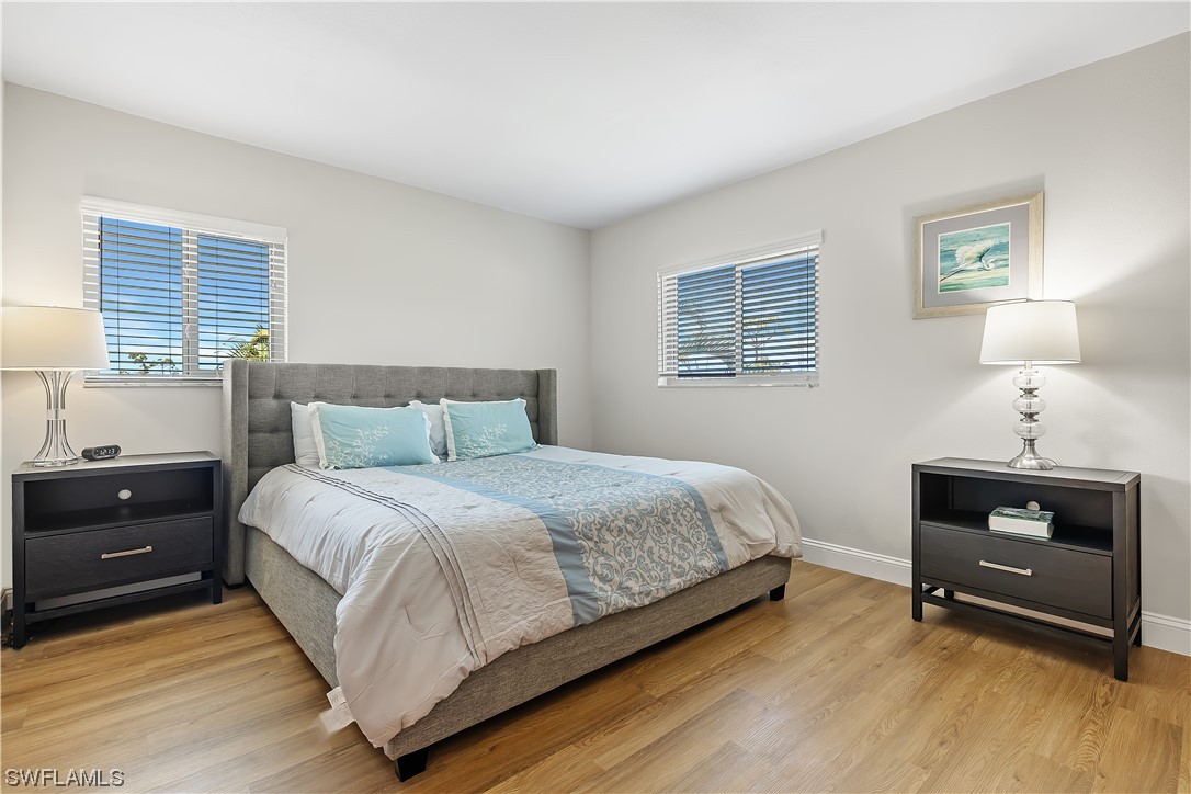 16650 Partridge Place Road, Unit 201 Fort Myers, FL 33908 - Photo 17 of 32 a bedroom with a bed and a window
