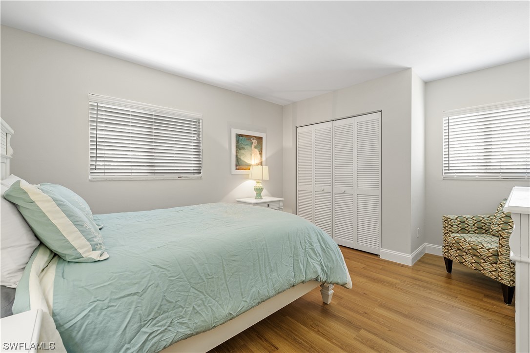 16650 Partridge Place Road, Unit 201 Fort Myers, FL 33908 - Photo 21 of 32 a bedroom with a bed and a window