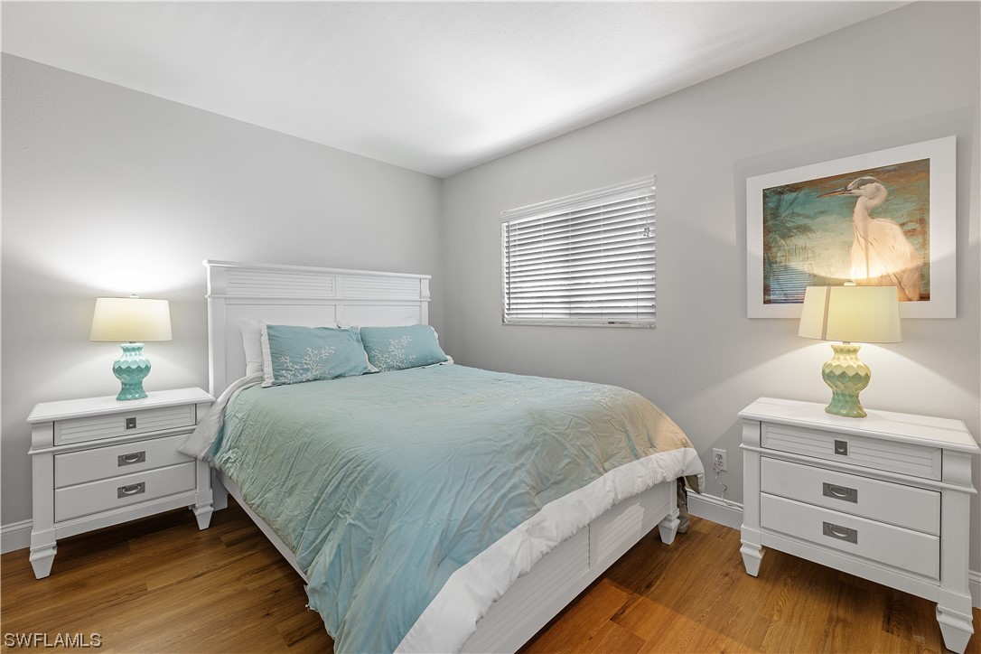 16650 Partridge Place Road, Unit 201 Fort Myers, FL 33908 - Photo 22 of 32 a bedroom with a bed and a window