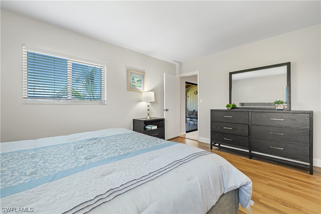 16650 Partridge Place Road, Unit 201 Fort Myers, FL 33908 - Photo 24 of 32 a bedroom with a bed and a dresser