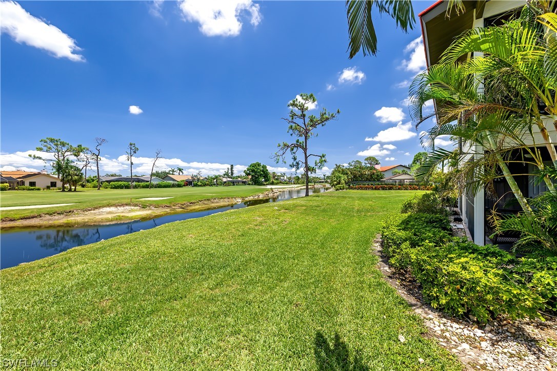 16650 Partridge Place Road, Unit 201 Fort Myers, FL 33908 - Photo 29 of 32 a view of a golf course with a big yard