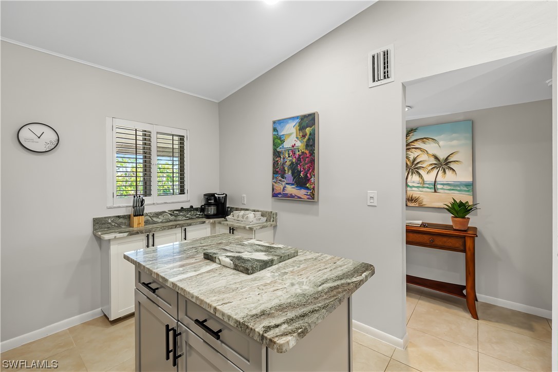 16650 Partridge Place Road, Unit 201 Fort Myers, FL 33908 - Photo 4 of 32 a view of a kitchen area with furniture and window