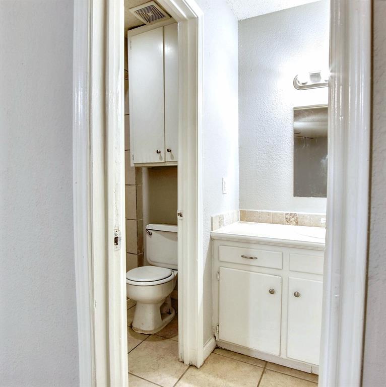 5354 Wonder Drive Fort Worth, TX 76133 - Photo 6 of 10 a bathroom with a sink and a toilet