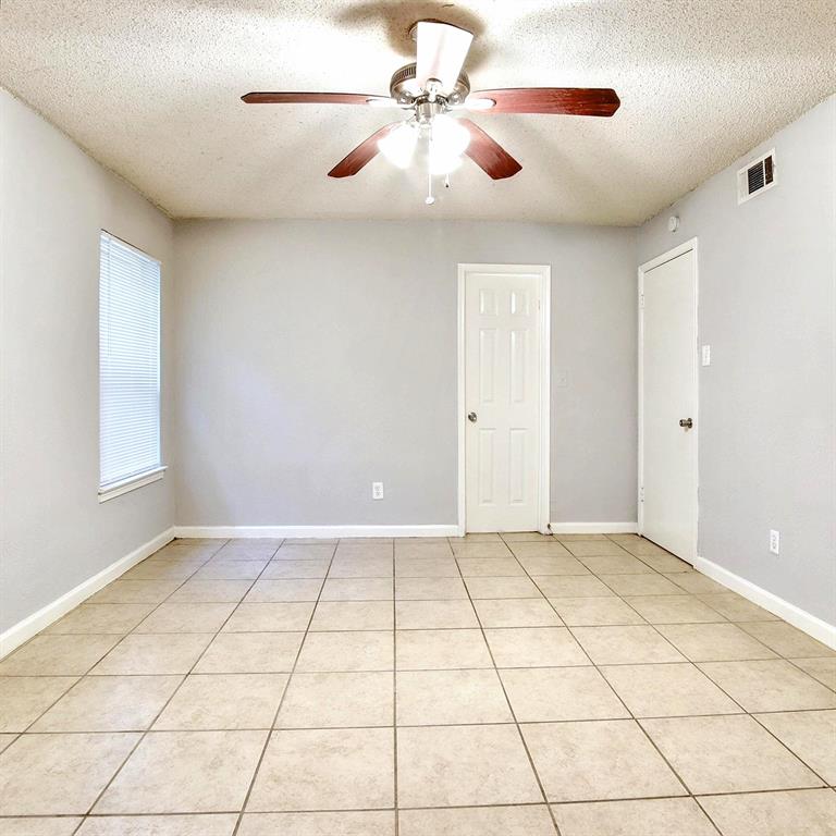 5354 Wonder Drive Fort Worth, TX 76133 - Photo 7 of 10 a view of an empty room with a window