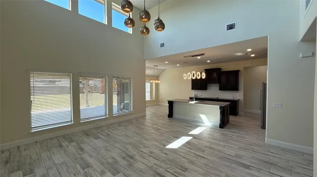 a view of an entryway with wooden floor