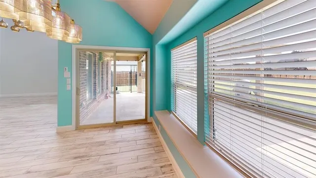 a view of a balcony with wooden floor
