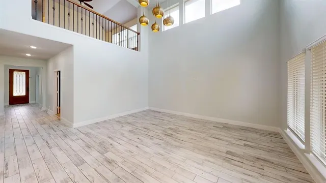 a view of an entryway with wooden floor