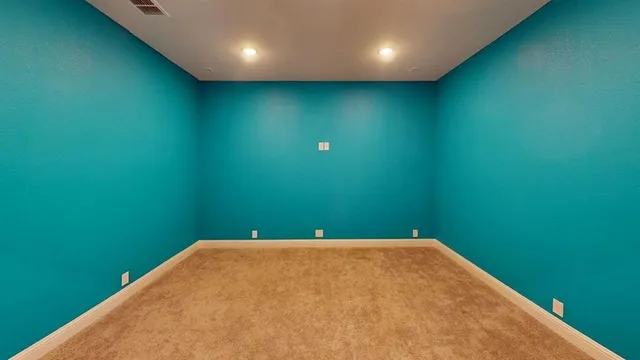 a view of a big room with a fan